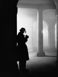Silhouette of Man Lighting Pipe Photographic Print