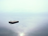 A Dock Appears to Hover in Mid-Air on the Placid Waters of Lake Thun Photographie par Jodi Cobb