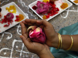 A Hindu Woman Worshipper Holding Rose Offering at the Sri Srinivasa Permual Temple, Singapore Photographic Print by Michael Coyne