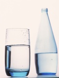 Bottle and glass of water Photographic Print