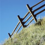 Low angle view of rustic wooden fence Photographic Print