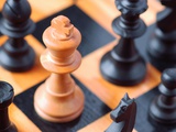 Chess pieces on chessboard Photographic Print