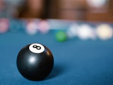 Eight ball on pool table Photographic Print