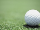 Golf Ball Sitting on the Green Photographic Print