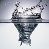 Droplet Penetrating Water's Surface Photographic Print