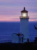 Lit-Up Lighthouse at Twilight Photographic Print by Mark Karrass