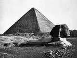 The Sphinx and the Pyramid of Cheops Standing in the Desert Photographic Print