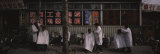 Three Men Getting a Hair Cut in Front of a Building, Beijing, China Photographic Print by Panoramic Images 