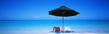 Chairs under an Umbrella on the Beach, Turks and Caicos Islands, North Atlantic Ocean Photographic Print by Panoramic Images 