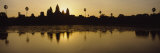 Silhouette of a Temple at Sunrise, Angkor Wat, Cambodia Photographic Print by Panoramic Images 