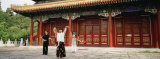 Two Women and a Man Dancing in Front of a Building, the Coal Hill Park, Beijing, China Photographic Print by Panoramic Images 