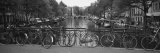 Bicycle Leaning Against a Metal Railing on a Bridge, Amsterdam, Netherlands Photographie par Panoramic Images 