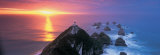 Sunset, Nugget Point Lighthouse, South Island, New Zealand Reprodukcja zdjęcia autor Panoramic Images Sunset, Nugget Point Lighthouse, South Island, New Zealand Reprodukcja zdjęcia autor Panoramic Images