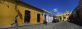 Woman Walking Beside a Building, Antigua, Guatemala Photographie par Panoramic Images 