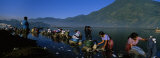 Group of Women Washing Clothes in a Lake, Lake Atitlan, Santiago Atitlan, Guatemala Photographic Print by Panoramic Images Group of Women Washing Clothes in a Lake, Lake Atitlan, Santiago Atitlan, Guatemala Photographic Print by Panoramic Images