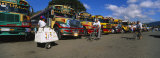 Buses Standing in a Row at a Bus Station, Antigua, Guatemala Photographic Print by Panoramic Images 