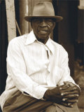 Man in Hat Sitting Down Posters par Nelson Figueredo
