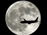 Jet Plane Passes in Front of the Full Moon Above Surfside, Florida Photographic Print
