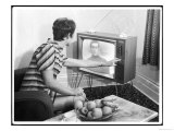 Young Woman with Short Dark Hair Wearing a Stripy Mini Dress Adjusts Her Television Set Giclee Print