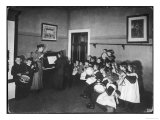 Music Lesson at a German School. One Teacher Plays the Piano reproduction procédé giclée