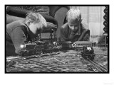 Two Blond Boys are Absorbed by Their Model Train Set Giclee Print