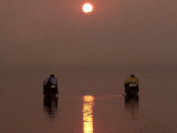 Kashmiris Homeward on a Shikara, or Traditional Gondola, at Sunset on Dal Lake in Srinagar, India Photographic Print