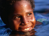 Child Playing in the Water, Manam Island, Madang, Papua New Guinea Photographic Print by Jerry Galea