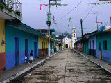 Painted Row of Houses with Distant Chapel in Acatlan, Veracruz, Mexico Photographic Print by Jeffrey Becom