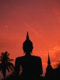 Buddha Against a Sunset at Wat Mahathat, Sukhothai, Thailand Photographic Print by Anders Blomqvist