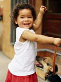 Young Girl with Puppy at Sunday Market, Mataderos, Buenos Aires, Argentina Photographic Print by Michael Taylor