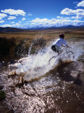 Mountain Biking Across a Creek Near St. Bathans, New Zealand Photographic Print by David Wall