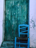 Chair in Front of a Green Door in the Village of Caceres, Caceres, Extremadura, Spain Photographic Print by Jeffrey Becom