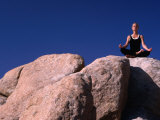 Yoga on the Rocks in the Joshua Tree National Park, California, USA Photographic Print by Cheyenne Rouse
