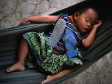 Baby Girl Sleeping in Hammock, Bavel, Cambodia Photographie par Jerry Galea