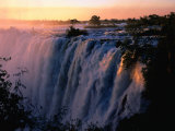 Victoria Falls at Sunset from Zambia, Victoria Falls, Zambia Fotografie-Druck von Dennis Johnson