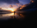 Man Jogging on Seminyak Beach at Sunset Seminyak, Bali, Indonesia Photographic Print by John Borthwick