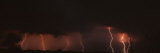 Forked Lightning under Dramatic Cloud Striking over a Field Lámina fotográfica por Panoramic Images Forked Lightning under Dramatic Cloud Striking over a Field Lámina fotográfica por Panoramic Images