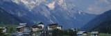 Village on a Landscape and a Mountain Range in the Background, St. Anton, Austria Lámina fotográfica por Panoramic Images