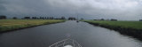 Motorboat in a Canal, Friesland, Netherlands Lámina fotográfica por Panoramic Images Motorboat in a Canal, Friesland, Netherlands Lámina fotográfica por Panoramic Images