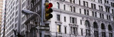Traffic Light in Front of a Building, Wall Street, New York, USA Reprodukcja zdjęcia autor Panoramic Images Traffic Light in Front of a Building, Wall Street, New York, USA Reprodukcja zdjęcia autor Panoramic Images