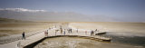 Tourists on a Pier, Badwater, Death Valley National Park, California, USA Lámina fotográfica por Panoramic Images