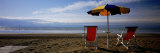 Two Empty Chairs under a Beach Umbrella, Lignano Sabbiadoro, Italy Photographic Print by Panoramic Images Two Empty Chairs under a Beach Umbrella, Lignano Sabbiadoro, Italy Photographic Print by Panoramic Images