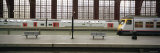Trains at a Railroad Station Platform, Antwerp, Belgium Lámina fotográfica por Panoramic Images