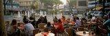Tourists Sitting at a Sidewalk Cafe, Lignano Sabbiadoro, Italy 写真プリント - パノラマ写真・