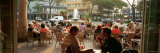 Tourists at a Sidewalk Cafe, Lignano Sabbiadoro, Italy Photographic Print by Panoramic Images 
