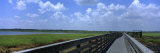 Clouded Sky over a Wooden Bridge, Myakka River State Park, Sarasota, Florida, USA Photographic Print by Panoramic Images 