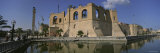 Reflection of a Building in a Pond, Assai Al-Hamra, Tripoli, Libya Fotografisk tryk af Panoramic Images