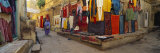 Market Vendor Sitting at a Market Stall, Jaisalmer, Rajasthan, India Lámina fotográfica por Panoramic Images Market Vendor Sitting at a Market Stall, Jaisalmer, Rajasthan, India Lámina fotográfica por Panoramic Images