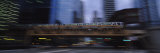 Electric Train Crossing a Bridge, Chicago, Illinois, USA Lámina fotográfica por Panoramic Images Electric Train Crossing a Bridge, Chicago, Illinois, USA Lámina fotográfica por Panoramic Images
