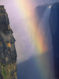 Victoria Falls with Rainbow in Spray, Zimbabwe Posters by Pete Oxford